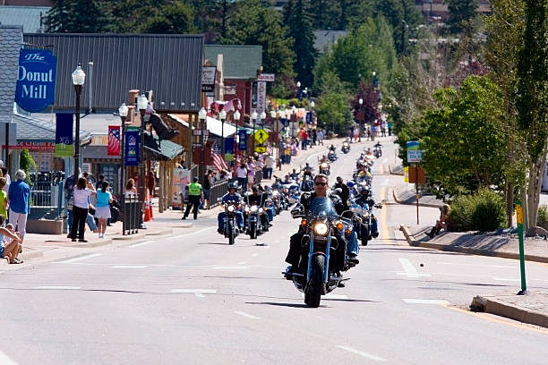 Salute to Veterans Motorcycle Bike Rally Woodand Park, Colorado, USA - August 16, 2014: Riders in a motorcycle rally to honor U.S. veterans runs from Woodland Park, Colorado to Cripple Creek, Colorado on Highway 24 political rally stock pictures, royalty-free photos & images