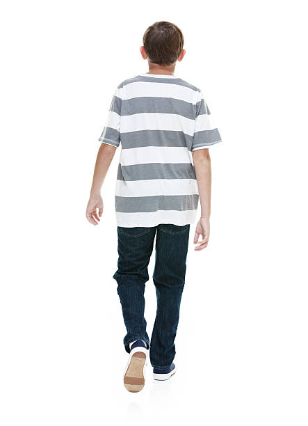 istock Rear view of boy walking 500300776