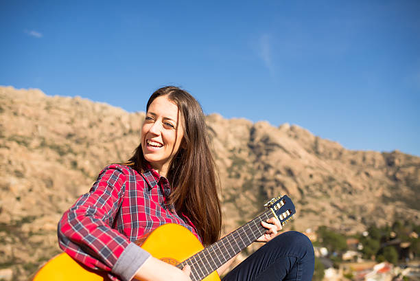 istock Smiling Woman with a Guitar 500300816