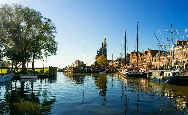 View to the small harbour in the city of Hoorn in the Netherlands. The tower is called the Hoofdtoren, dating from 1532. The houses date from the 16th and 17th century.