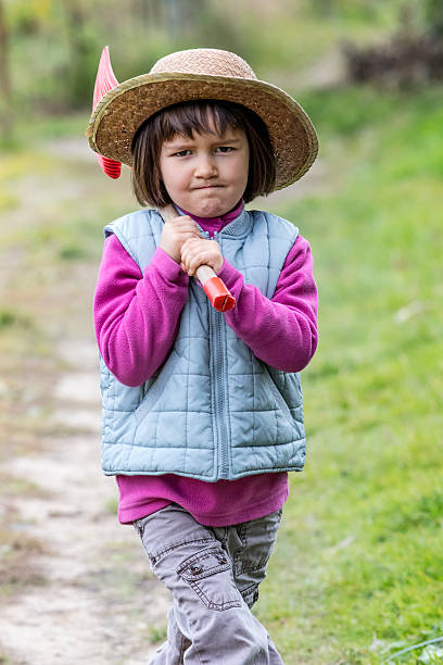 istock Decided 4-year old preschooler walking on garden path 500303888