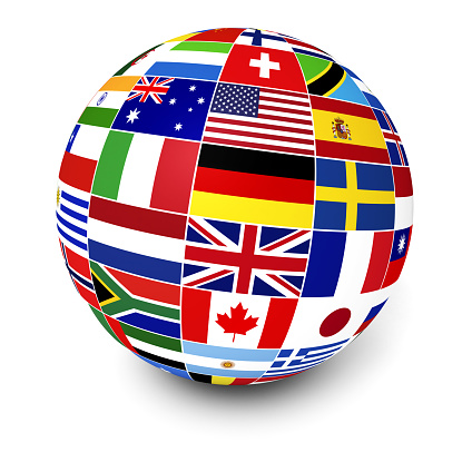 Travel, services and international business management concept with a globe and international flags of the world on white background.