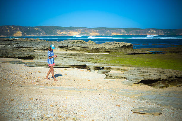 istock Woman Walking on the Beach 500305405
