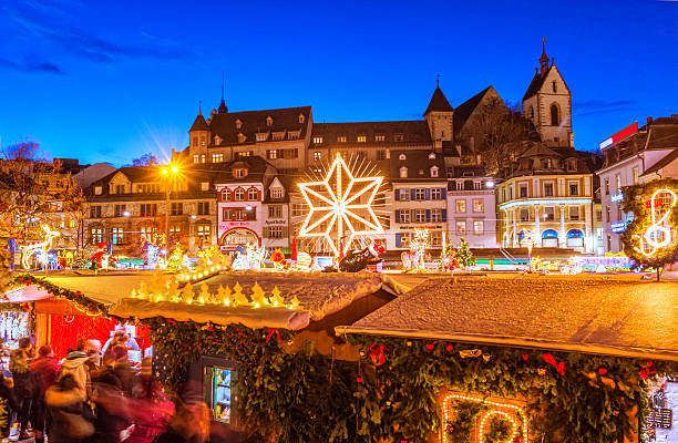 Christmas in Basel View over the christmas market at the Barfüssplatz in Basel, Switzerland, at dusk. christmas market stock pictures, royalty-free photos & images