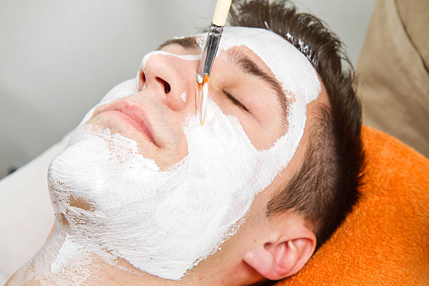 istock Therapist applying a face mask to  beautiful young man 500305901