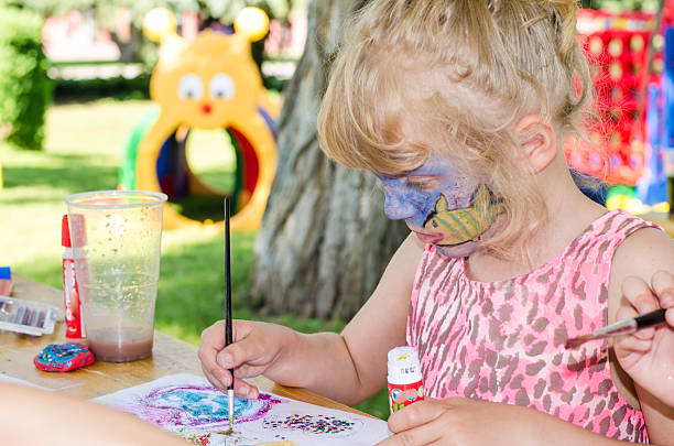 istock child with face painting 500307407
