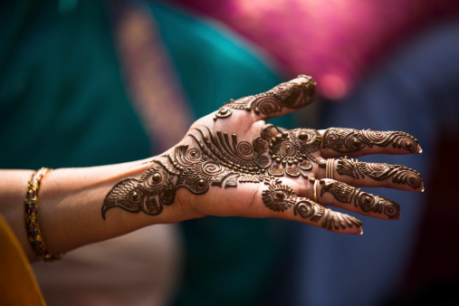 Henna, mehendi on a bride's hand. A traditional custom in the Asian Indian world