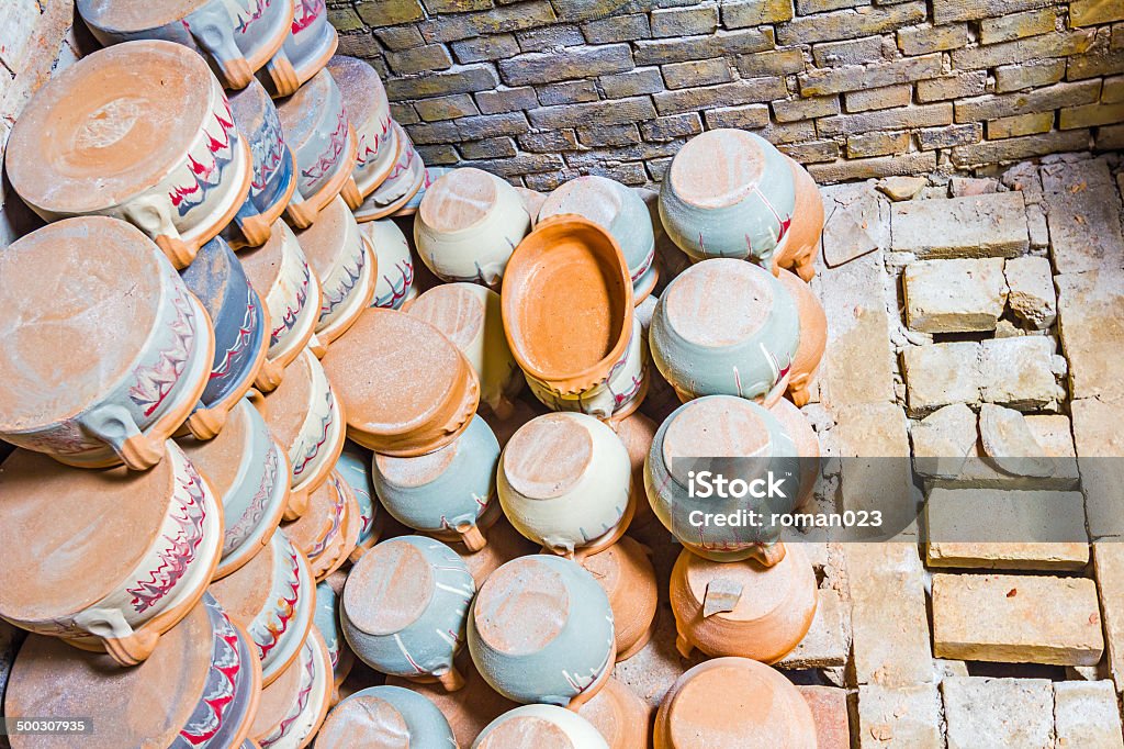 Freshly baked pottery Various colorful clay pots on pile in many shapes and sizes Abstract Stock Photo