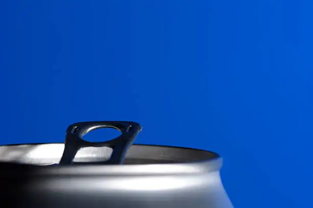 Side view of an open beverage can.