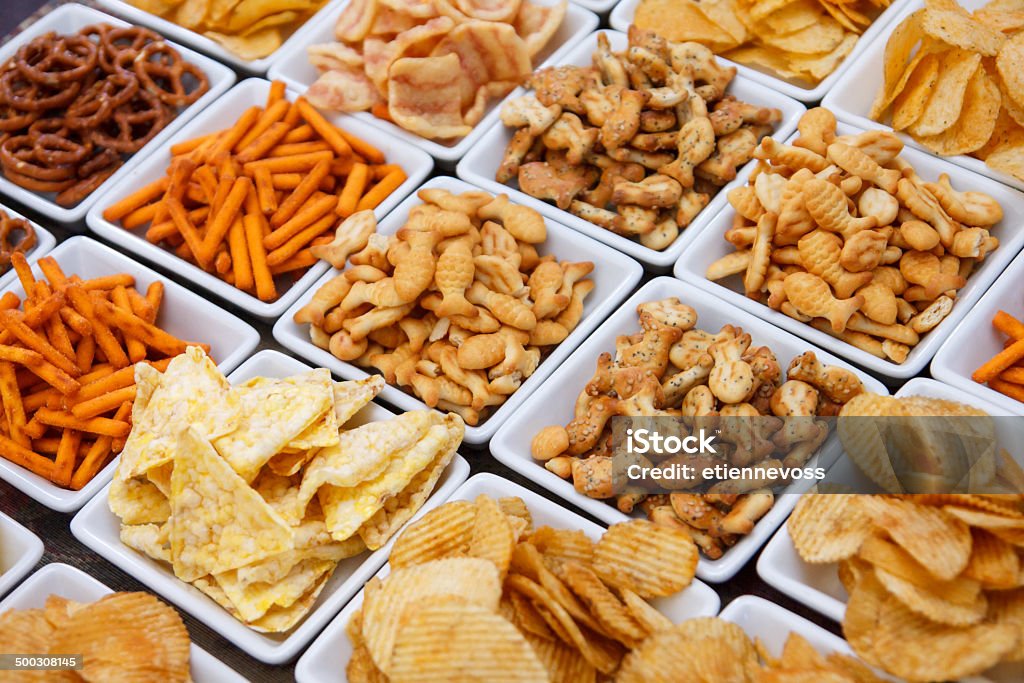 Many types of savoury snack in white dishes Snack Stock Photo