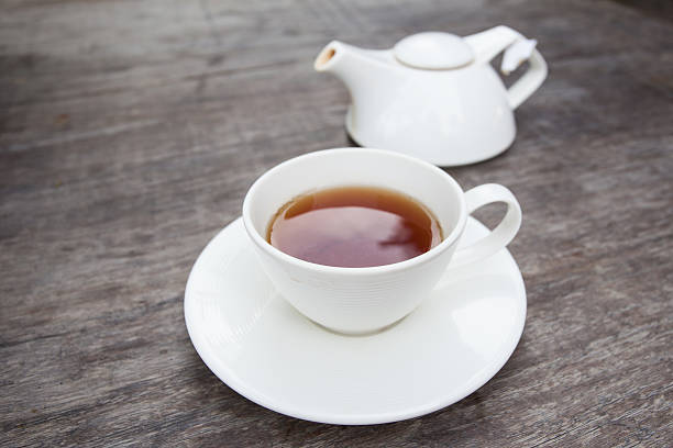 istock Cup of tea on old wooden table 500308857