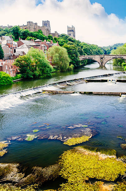 Durham, England The university town of Durham in north east England looking upstream along the River Wear towards Framwellgate Bridge, with parts of Durham Castle and Durham Cathedral on the skyline. AdobeRGB colorspace. river wear stock pictures, royalty-free photos & images