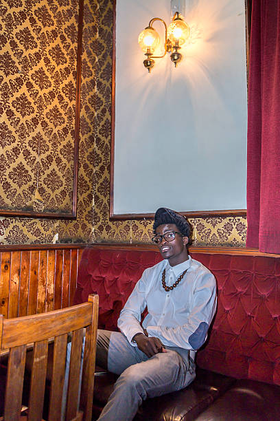 istock Young african man sitting in the bar 500310205