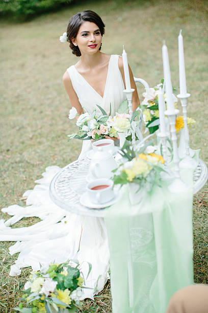 istock Woman sitting near decorated table 500322032