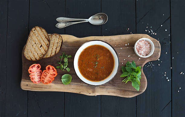 istock Roasted tomato soup with fresh basil, spices and bread in 500322554
