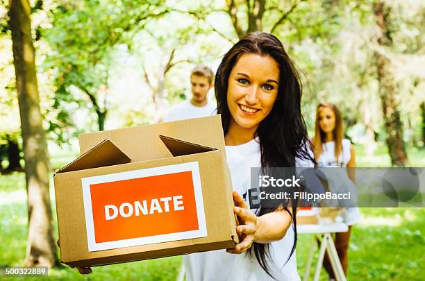 Volunteers Asking For Donations Stock Photo - Download Image Now - 20-24 Years, 20-29 Years, A Helping Hand