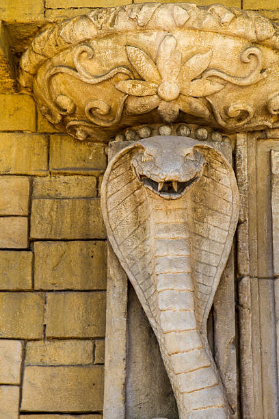 istock statue of the cobra on Indian temple 500323772