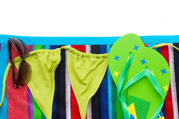 istock sandals ans swimming suit on towel 500323775