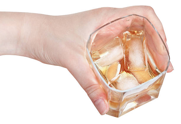istock whiskey on ice in glass isolated 500323863