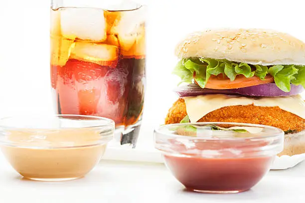 Chicken burger and glass of cola with ice