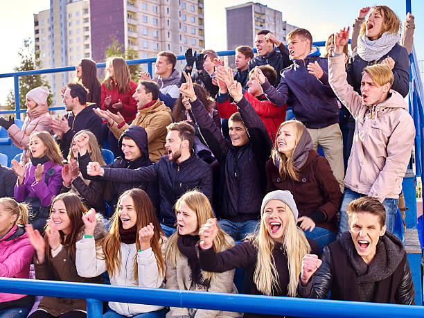 istock Sport fans clapping and singing on tribunes 500324388