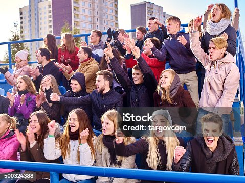 istock Sport fans clapping and singing on tribunes 500324388