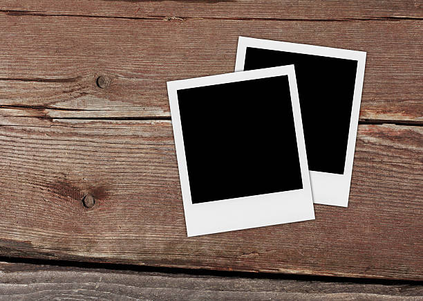 istock Blank Photo Frames On The Wood. 500324611