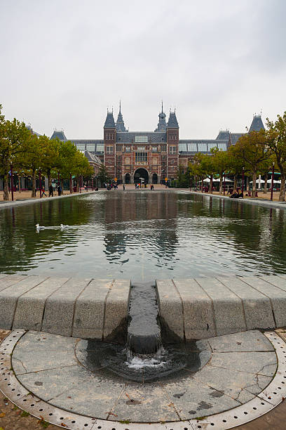 istock Rijksmuseum facade park and pool vertical view 500325033