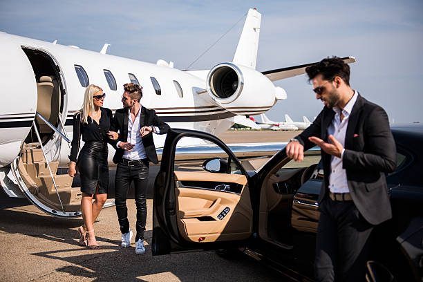 istock Elegant couple leaving private airplane 500325144