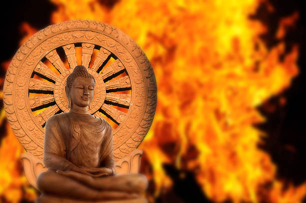 Buddha and Wheel of Dhamma on passion fire