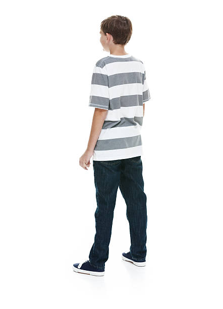 istock Rear view of boy standing and looking away 500325692