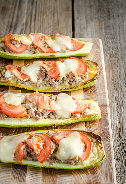 istock Stuffed zucchini on the wooden board 500326703
