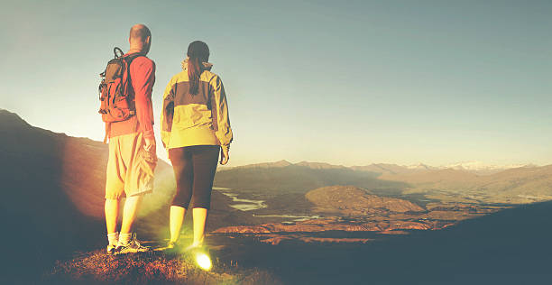 istock Adventurists Beautiful Sunrise Backpacker Climbing Concept 500329750