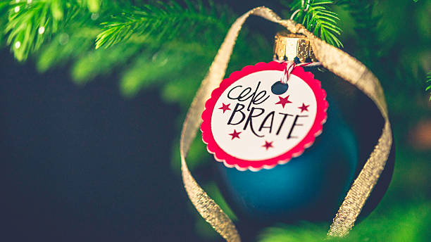 istock Christmas bauble with New Year message on Christmas tree branches 500331658