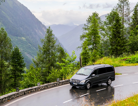 Tyrol, Austria - July 29, 2014: Black luxury van Mercedes-Benz W639 Vito drives at the Grossglockner High Alpine road.