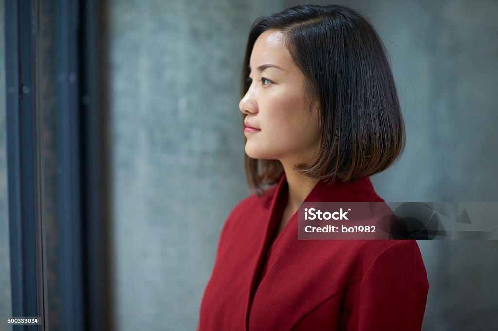 profile of one young asian businesswoman indoor Side View Stock Photo
