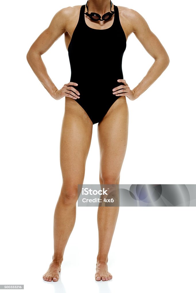 Female swimmer standing Female swimmer standinghttp://www.twodozendesign.info/i/1.png 20-29 Years Stock Photo
