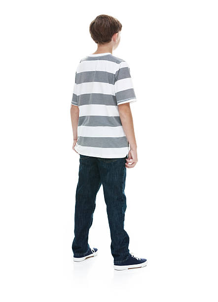 istock Rear view of boy standing and looking away 500336830