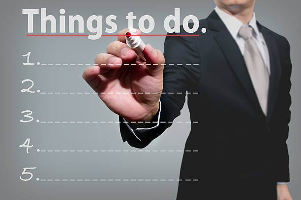istock business man hand checking the things to do. 500340303