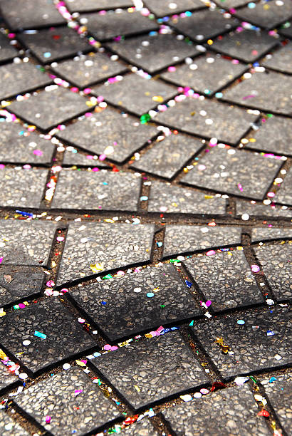 Confetti on a sidewalk stock photo