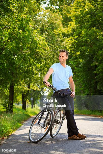 Man With Bicyce Stock Photo - Download Image Now - Effortless, Looking, Men