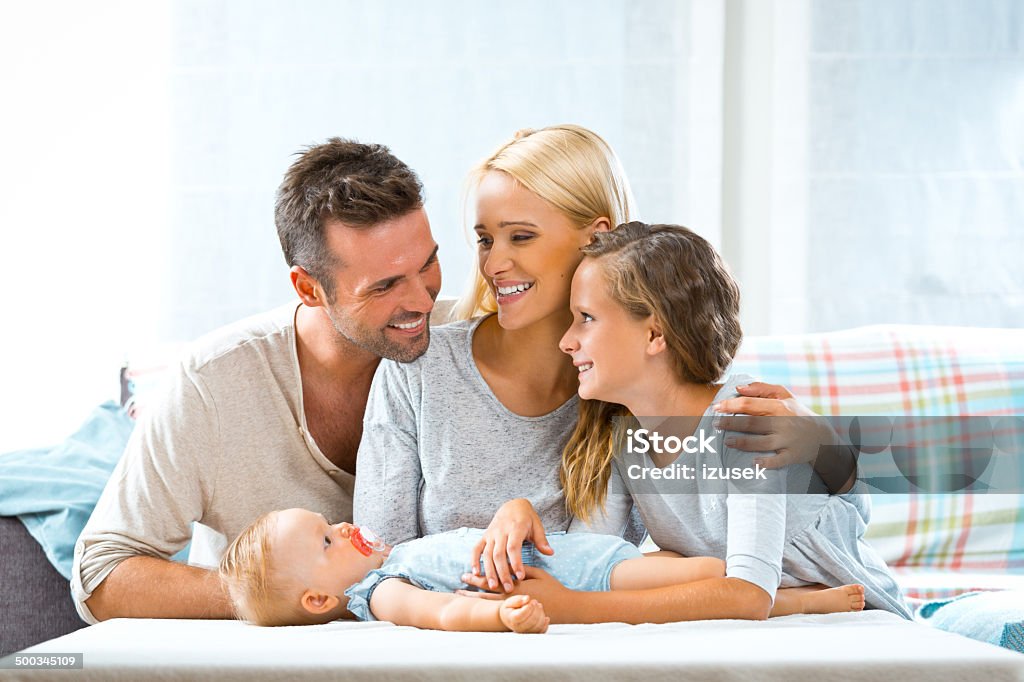 Happy family at home Indoors portrait of happy parents with their children.  Family Stock Photo