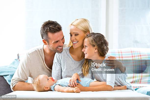 Happy Family At Home Stock Photo - Download Image Now - Family, House, Blond Hair