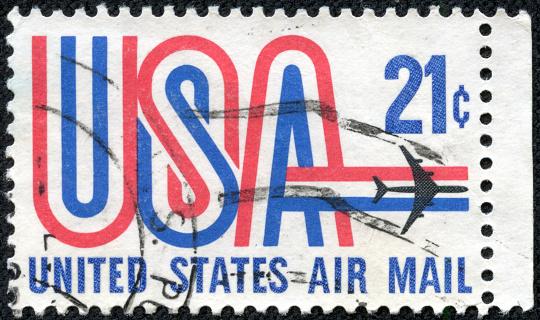 United States postage stamp 1968 in the value of 20c used for overseas air mail deliveries showing the letters USA in red, white and blue and the print United States Air Mail