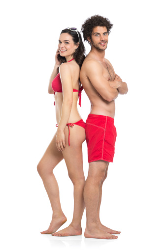 Happy Couple In Red Swimwear Standing Isolated On White Background