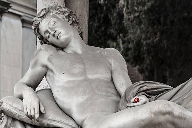 Summer Camp ROME, ITALY - MARCH 25 2014: Outdoor Picture of a Statue of a naked young man from the famous Cemetary Campo Verano near San Lorenzo on March 25 2014 in Rome in Italy san lorenzo rome photos stock pictures, royalty-free photos & images
