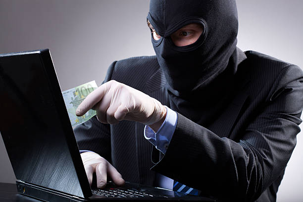 istock Dangerous businessman uses a laptop 500346469