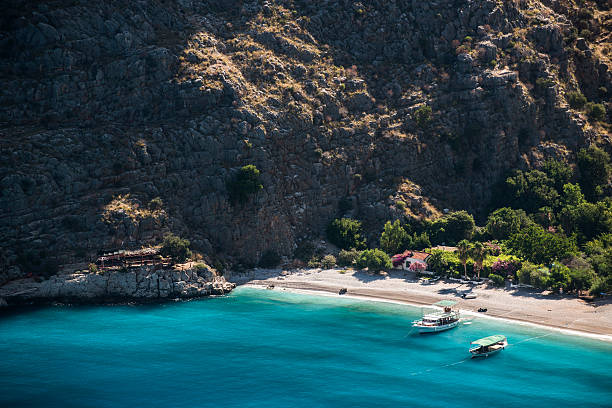 Butterfly Valley The Butterfly Valey in the city of Oludeniz/Fethiye in western Turkey. You can only reach this valey by boat.The Butterfly Valey in the city of Oludeniz/Fethiye in western Turkey. You can only reach this valey by boat. sunning butterfly stock pictures, royalty-free photos & images