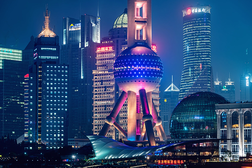 Futuristic illuminated Pudong Skyline Skyscapers in Shanghai with Oriental Pearl Tower, Shanghai, China.