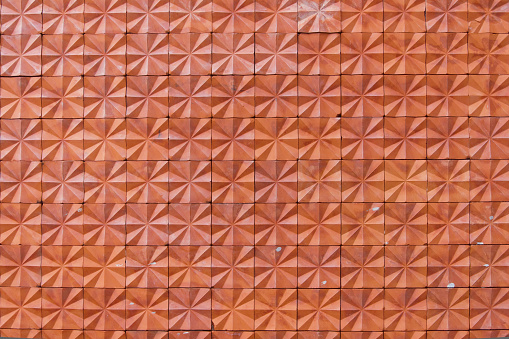 Closeup of a brick wall with red bricks - texture background